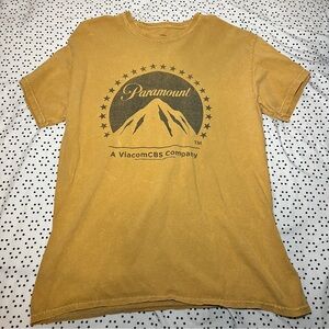Dark yellow goldish paramount t-shirt.